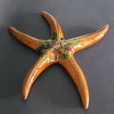 Two vintage ceramic wall pots featuring a seahorse and a starfish.