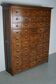 Large dutch oak apothecary cabinet / barber cabinet with enamel shields, 1900s