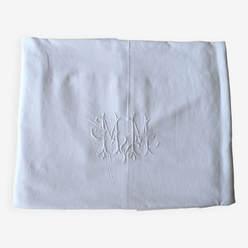 Old white hand-embroidered and monogrammed sheet