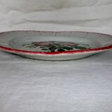 Old earthenware plate of the East Strasbourg decorated with flowers