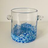 Cylindrical vase with handles in colorless glass splashed with blue and white in the lower part
