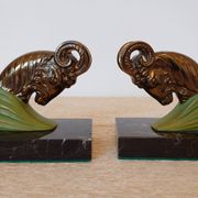 Art Deco pair of bookends with ram's heads, patinated metal and black marble.