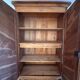 Antique 2-door wardrobe made of solid wood with shelves and drawers.
