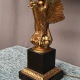 Large lamp with a bronze eagle figure.