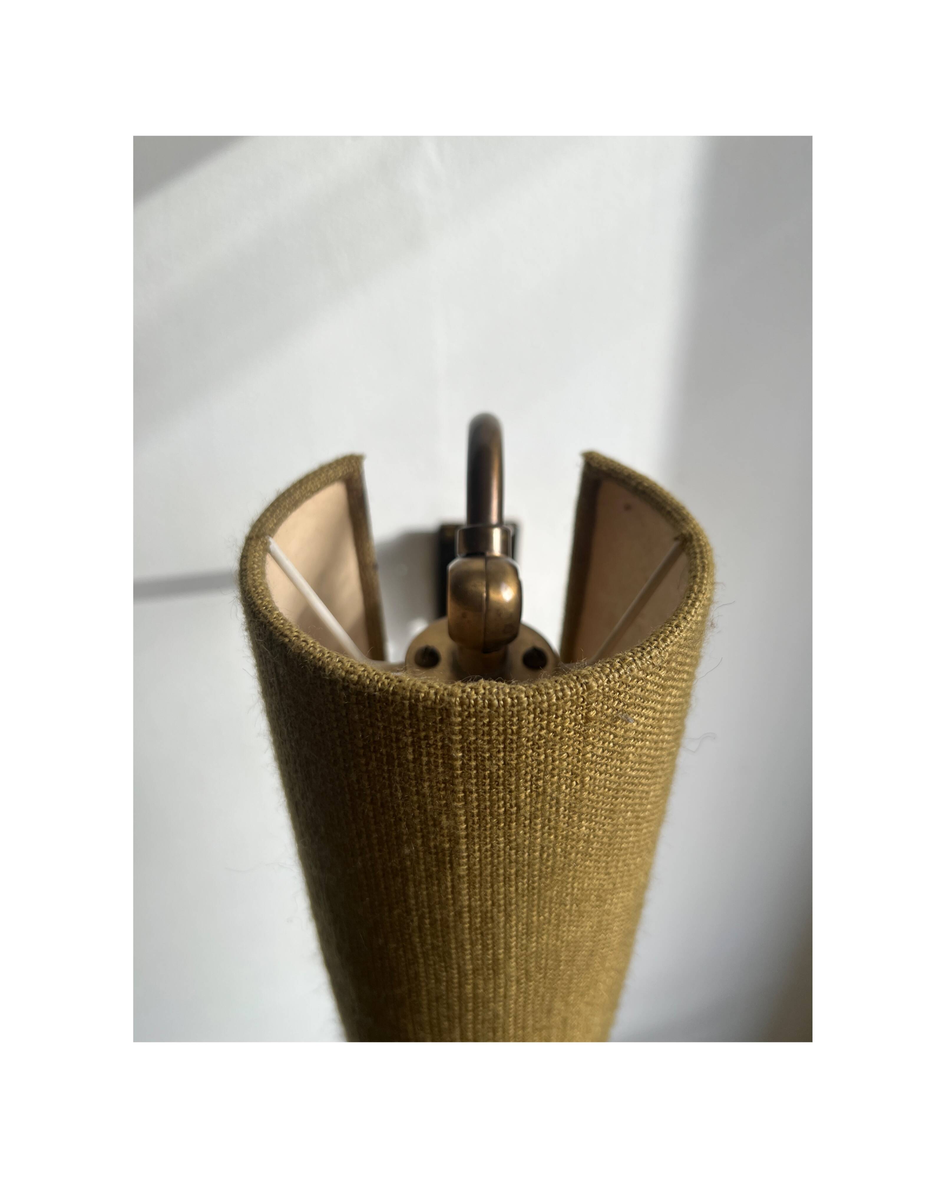 Wall sconce, brass bracket and khaki lampshade, France 1950