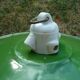 Old pendant lamp lamp in green enamelled sheet metal and porcelain socket
