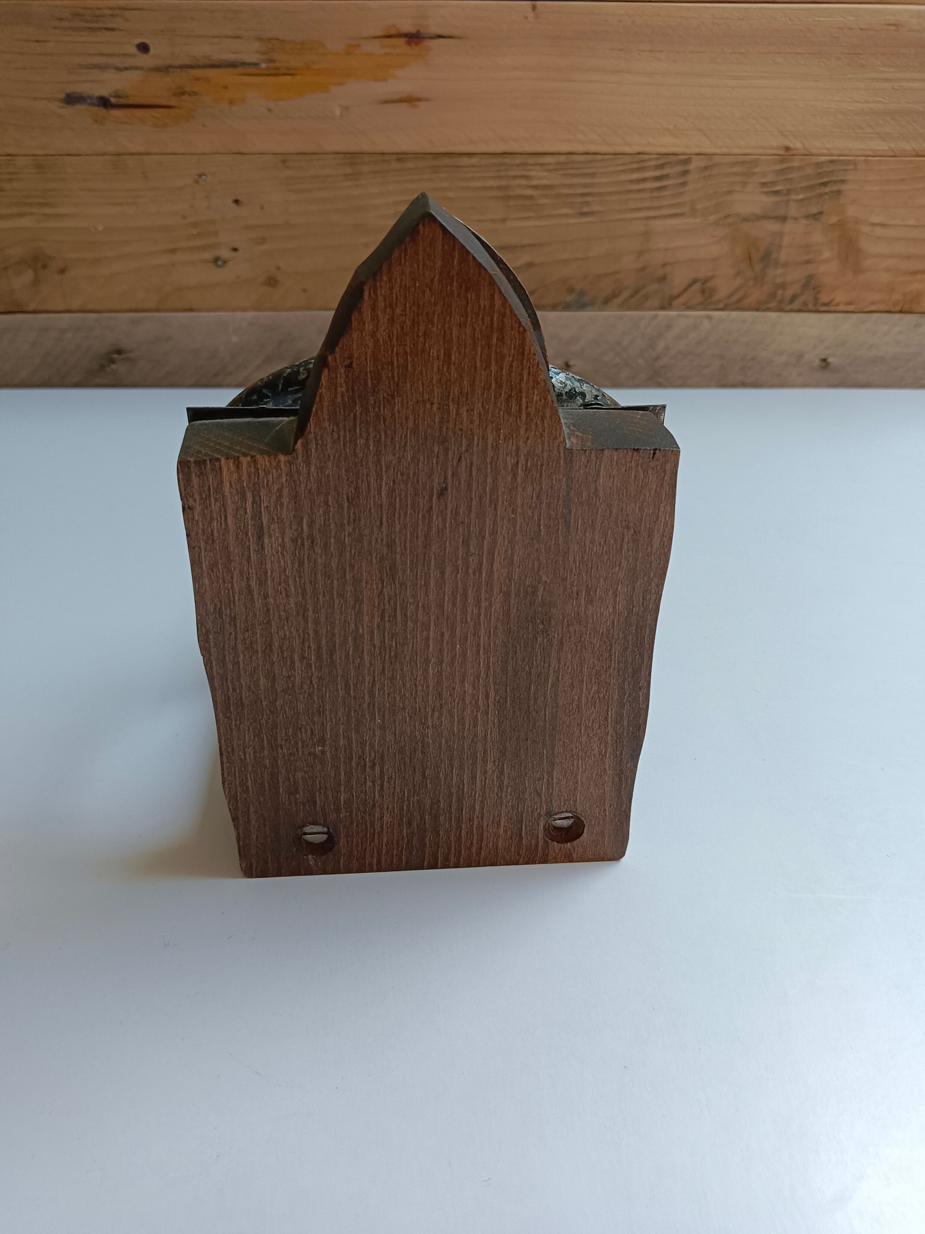 Medieval-style bookends, antique door handle.