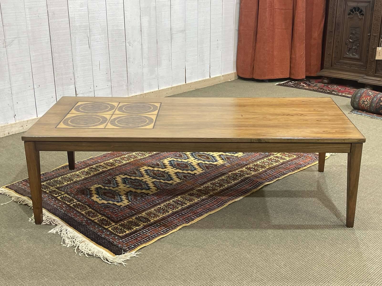 English coffee table in rosewood with tiled section from the 1970s.