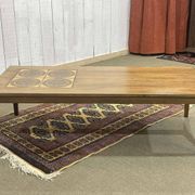 English coffee table in rosewood with tiled section from the 1970s.