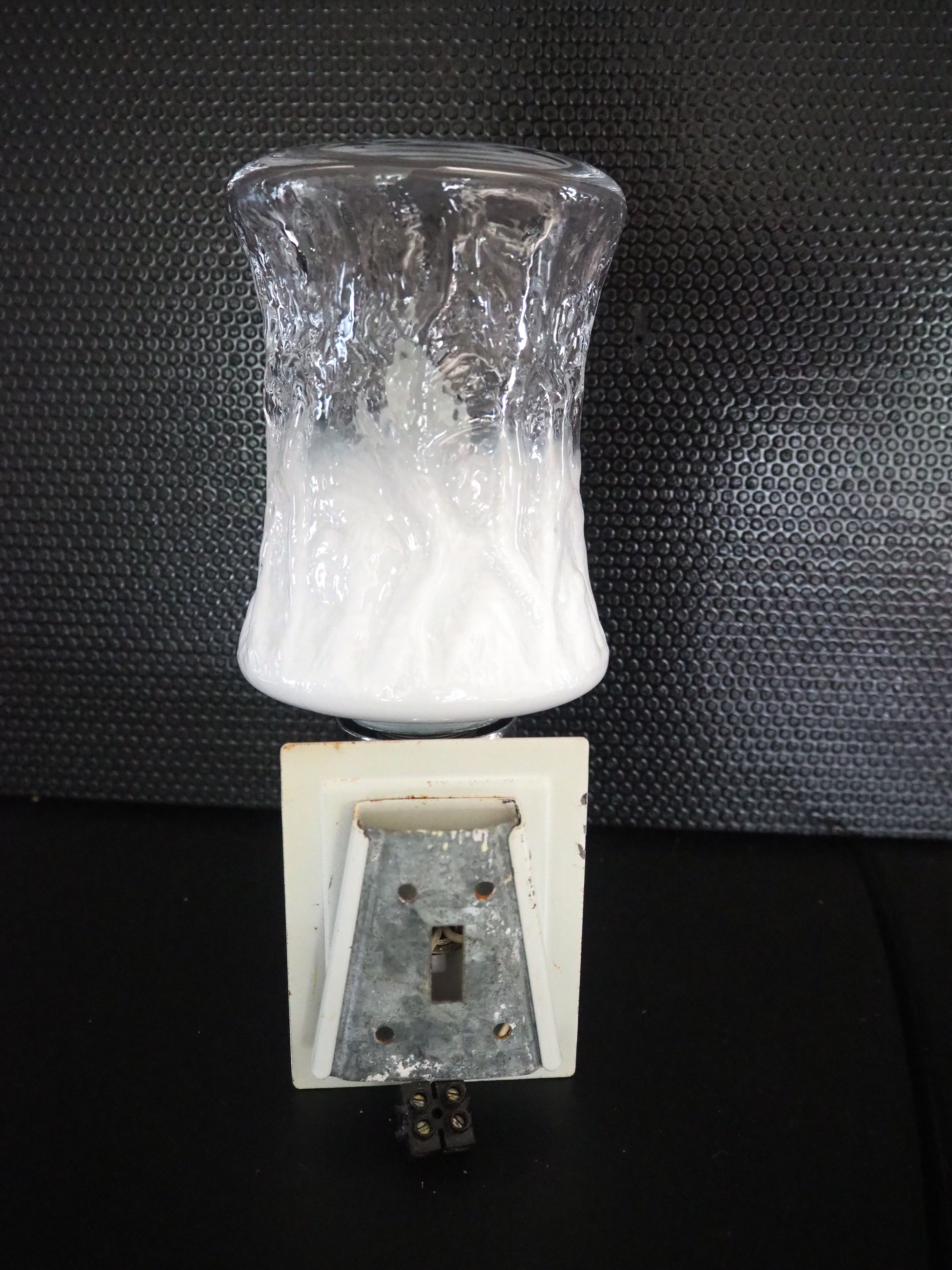 Torch type wall lamp in transparent and white glass