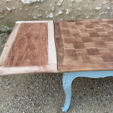 Louis XV style walnut table with a natural wood top.