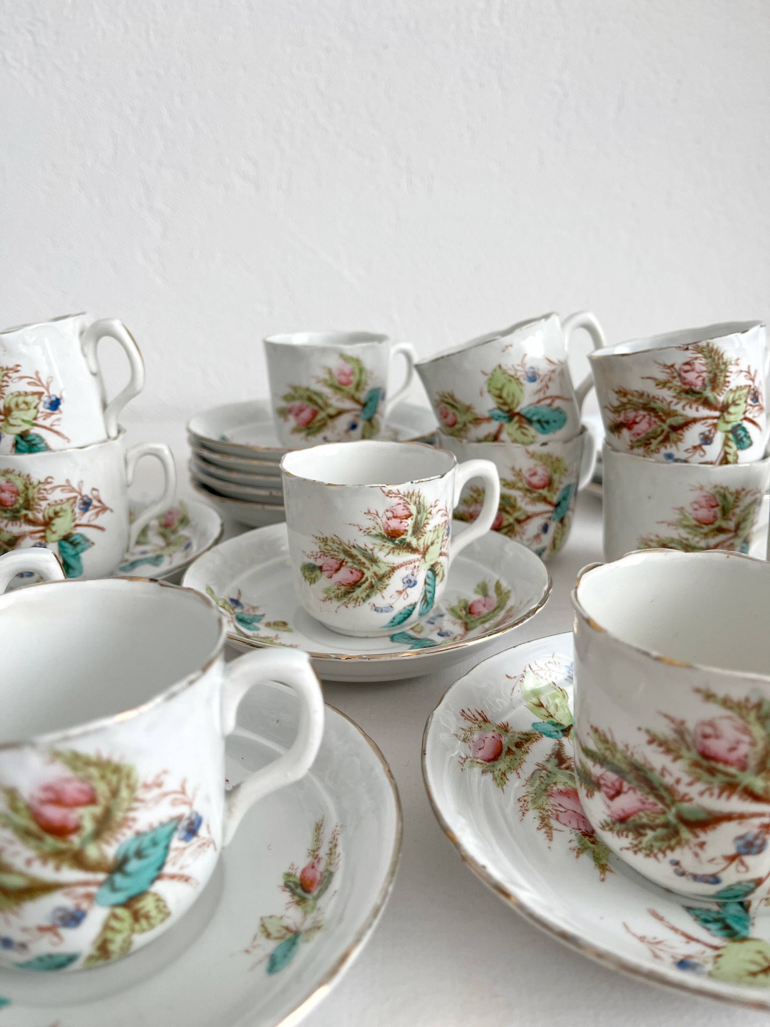 12 ironstone coffee cups with polychrome floral decoration, KG Lunéville