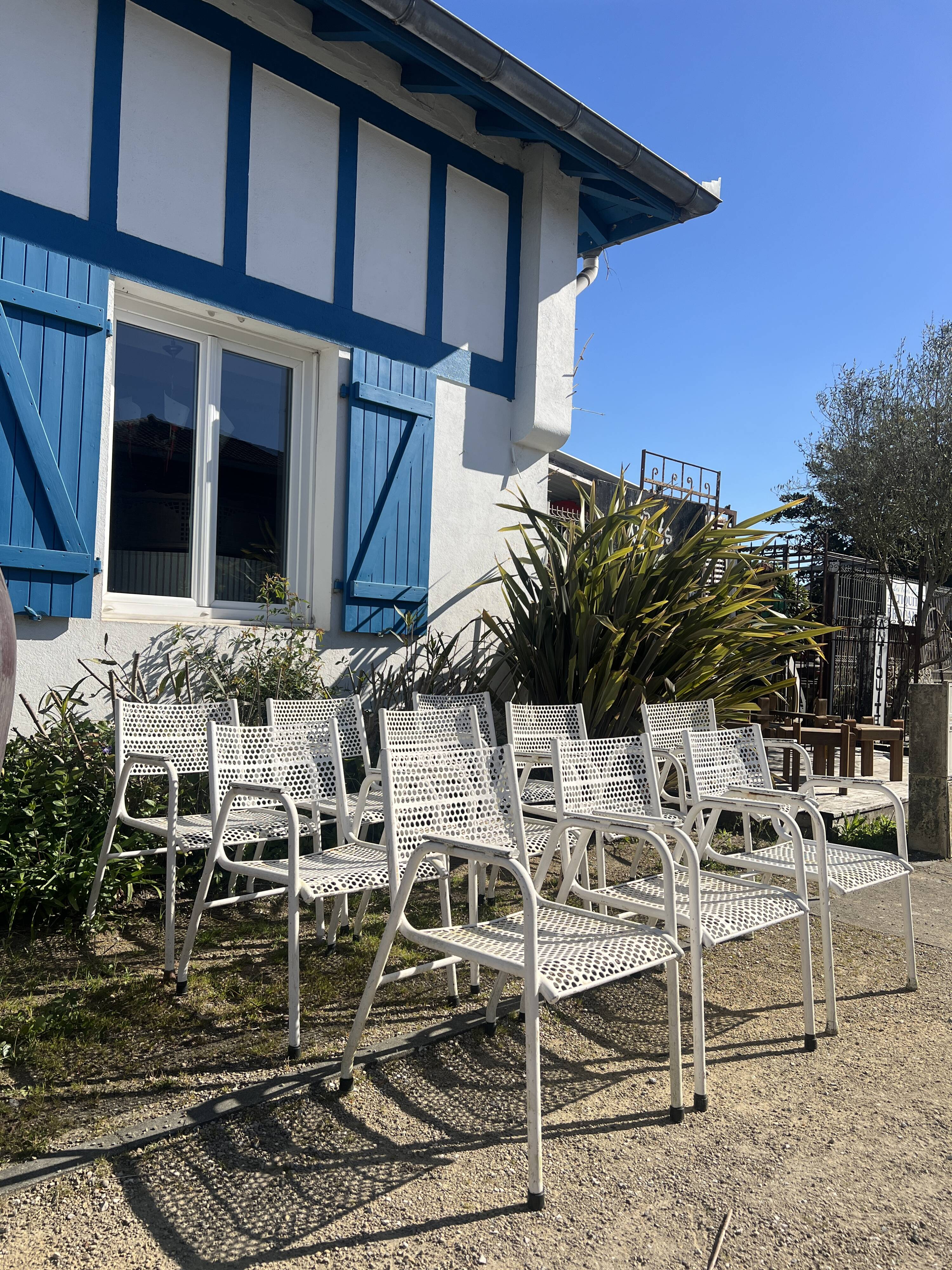 Set of 10 perforated metal garden chairs