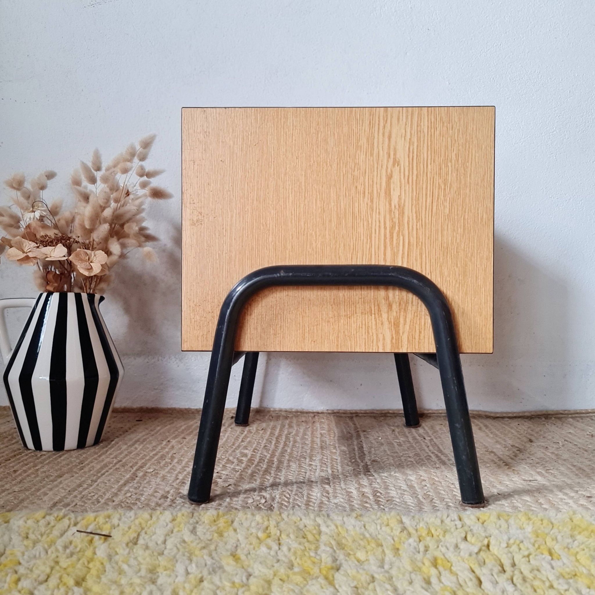 Bedside table - small wooden piece of furniture with a tubular metal base.