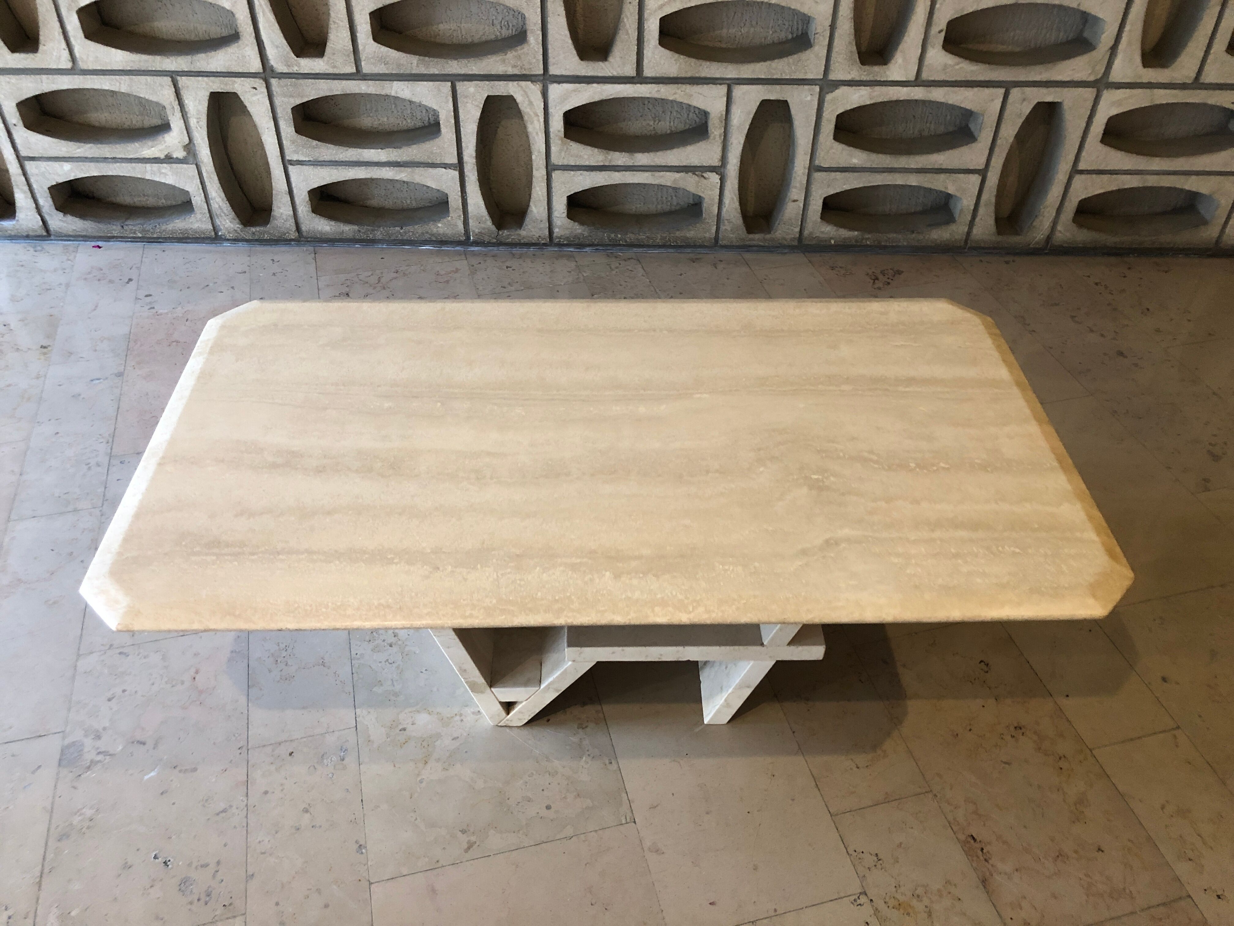 Rectangle travertine table with geometric foot