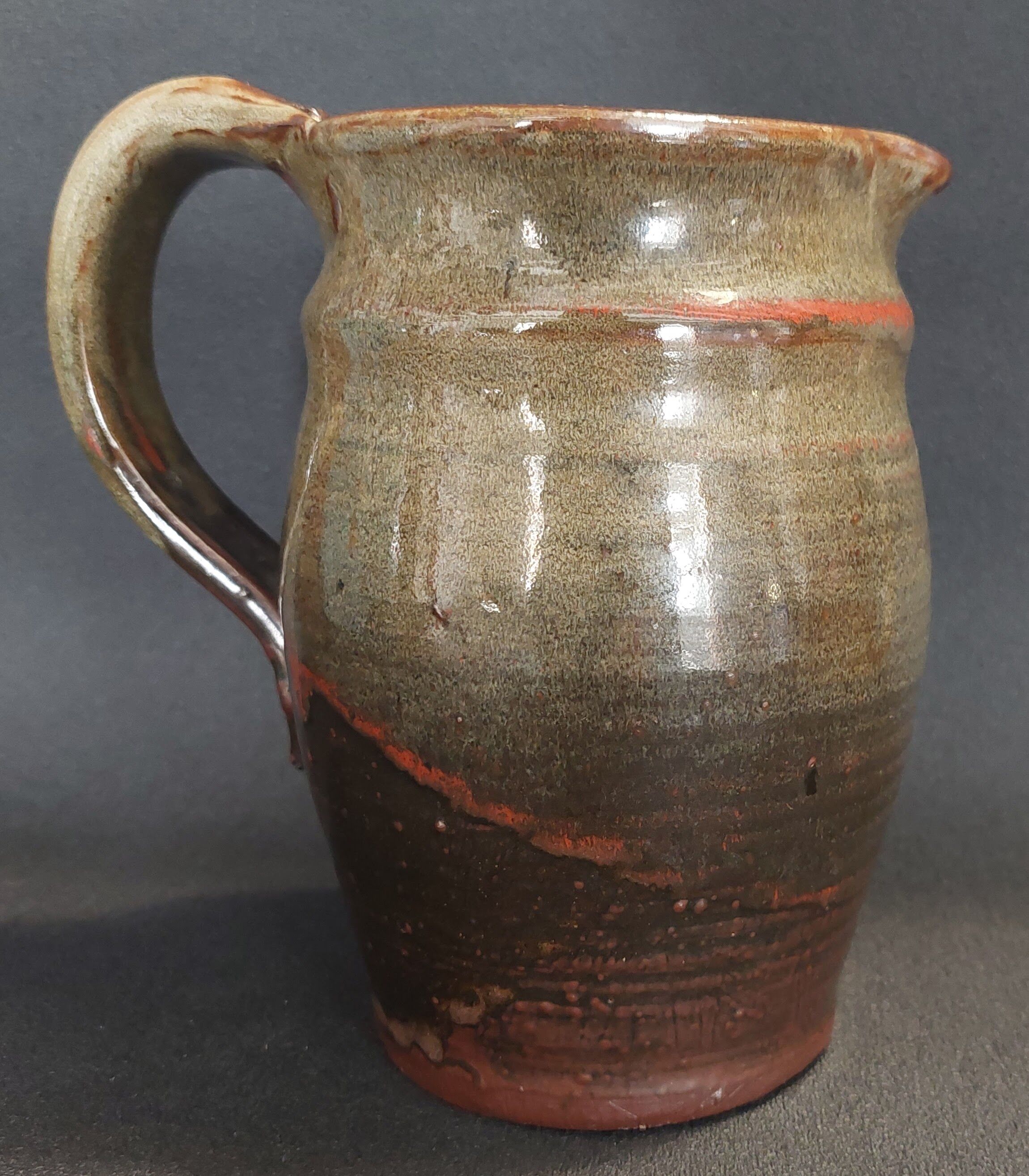 Ceramic pitcher from the 20th century with a signature to identify.