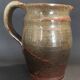 Ceramic pitcher from the 20th century with a signature to identify.