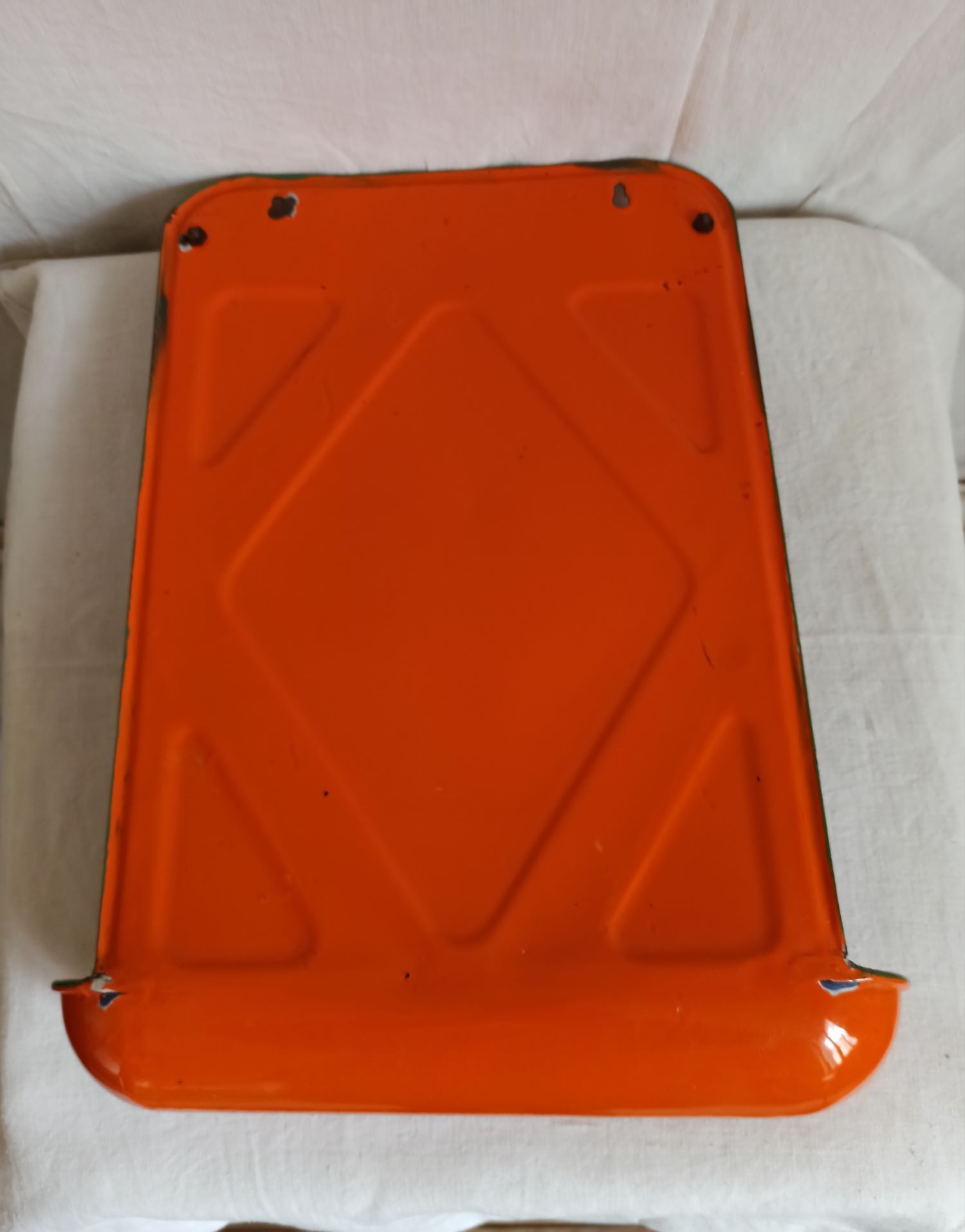 Orange enamelled kitchen utensil door
