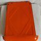 Orange enamelled kitchen utensil door