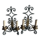 Pair of wall sconces in wrought iron with golden leaf patterns.