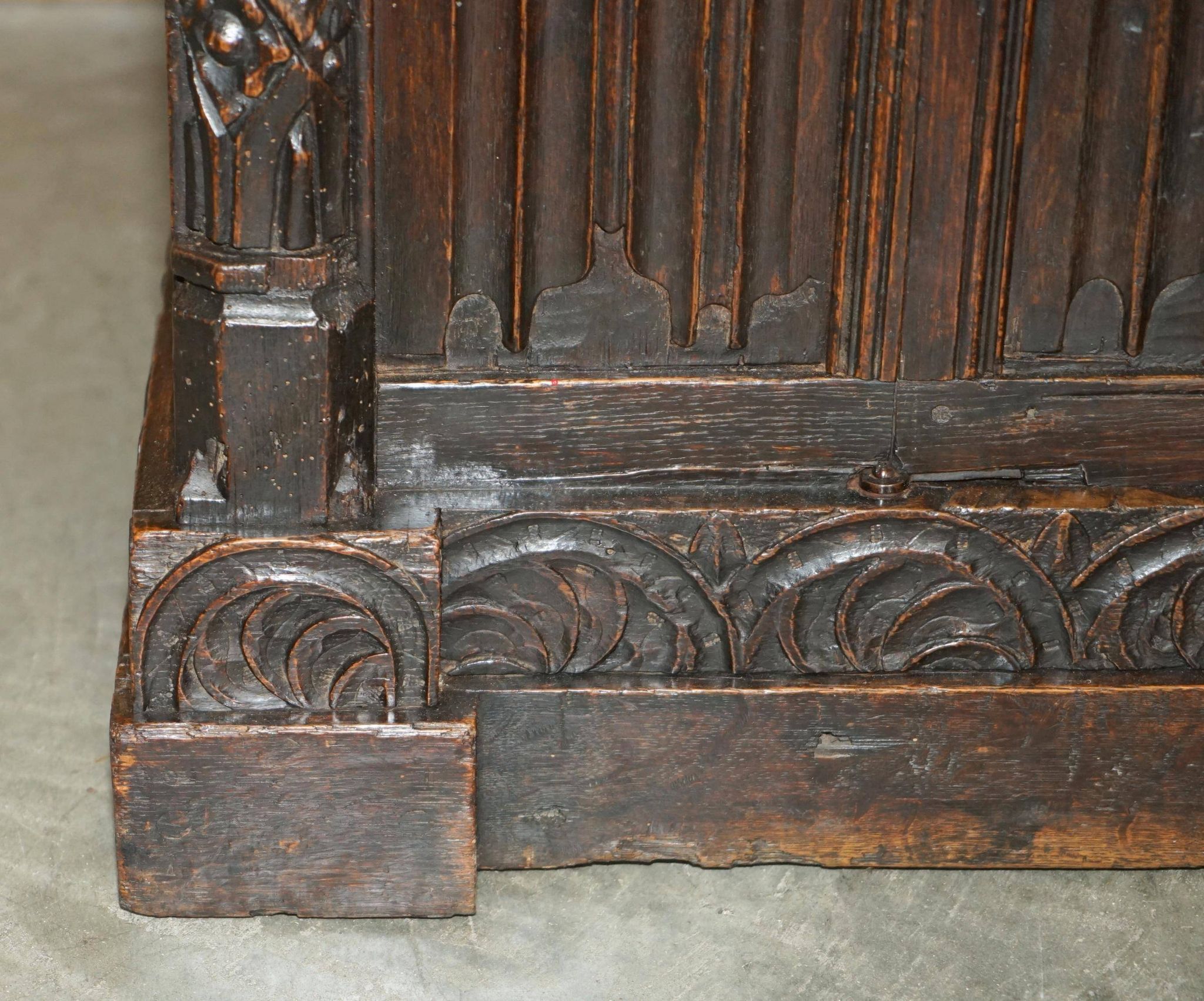 Jacobean hardwood library with carved panels and glass doors.