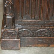 Jacobean hardwood library with carved panels and glass doors.