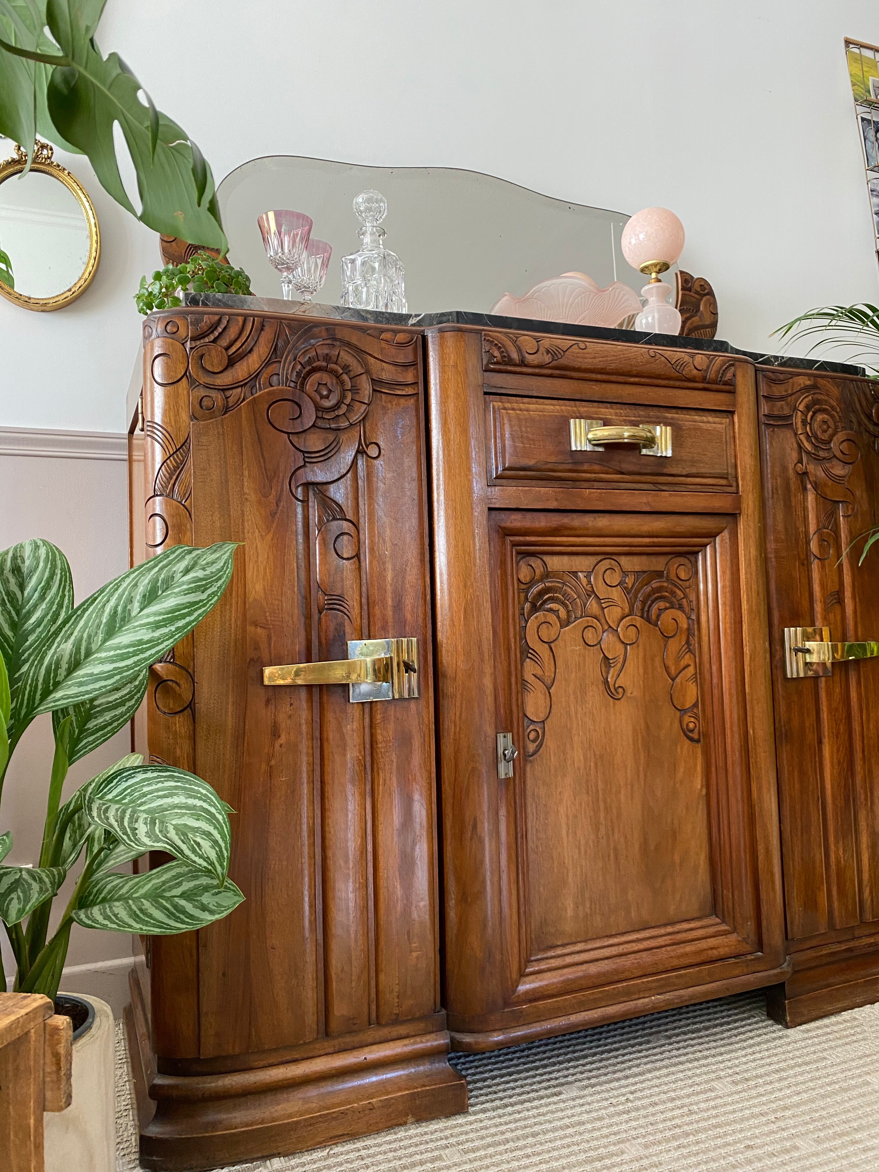 Art Deco black marble sideboard and vintage beveled mirror