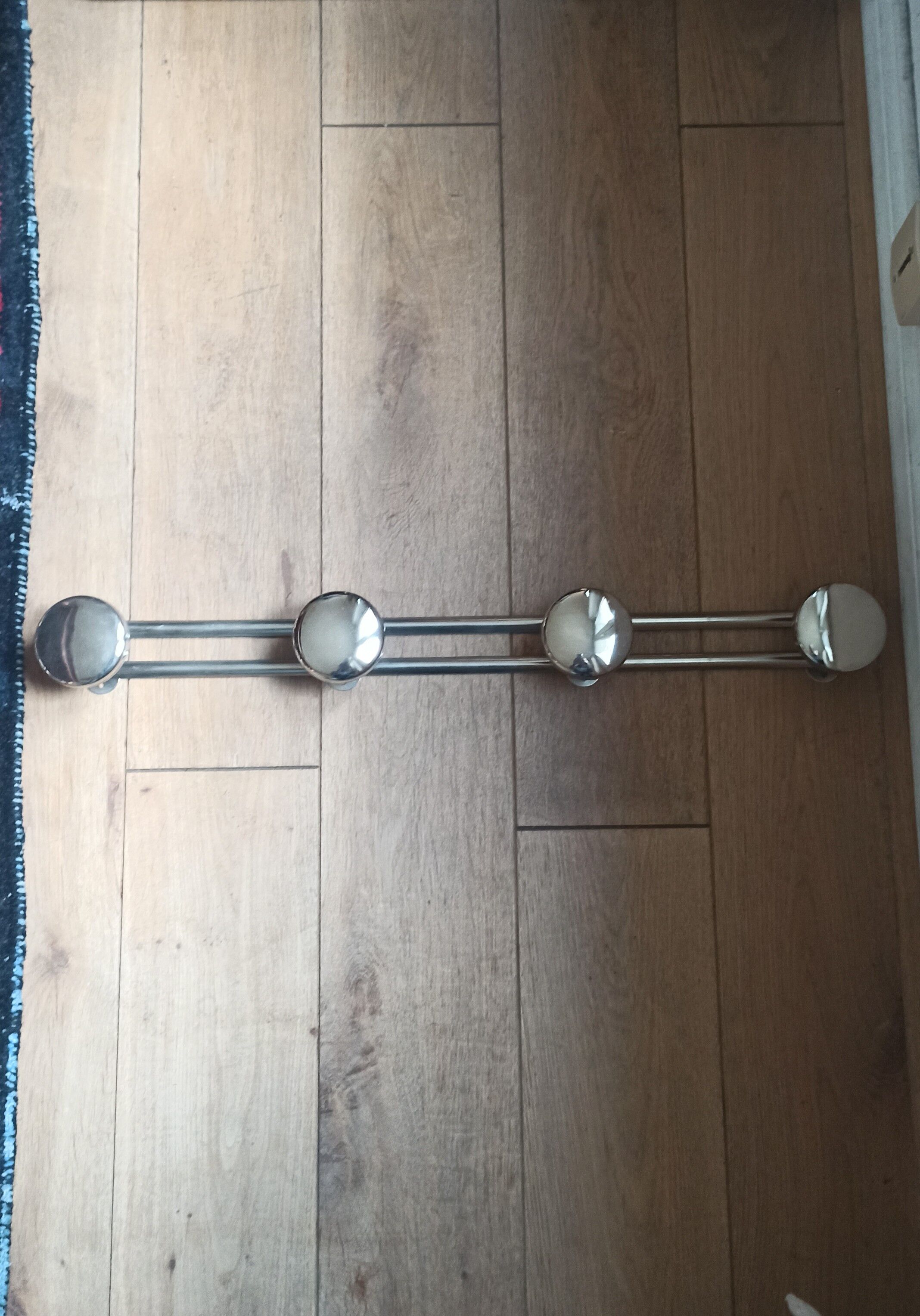 Metal wall coat rack
