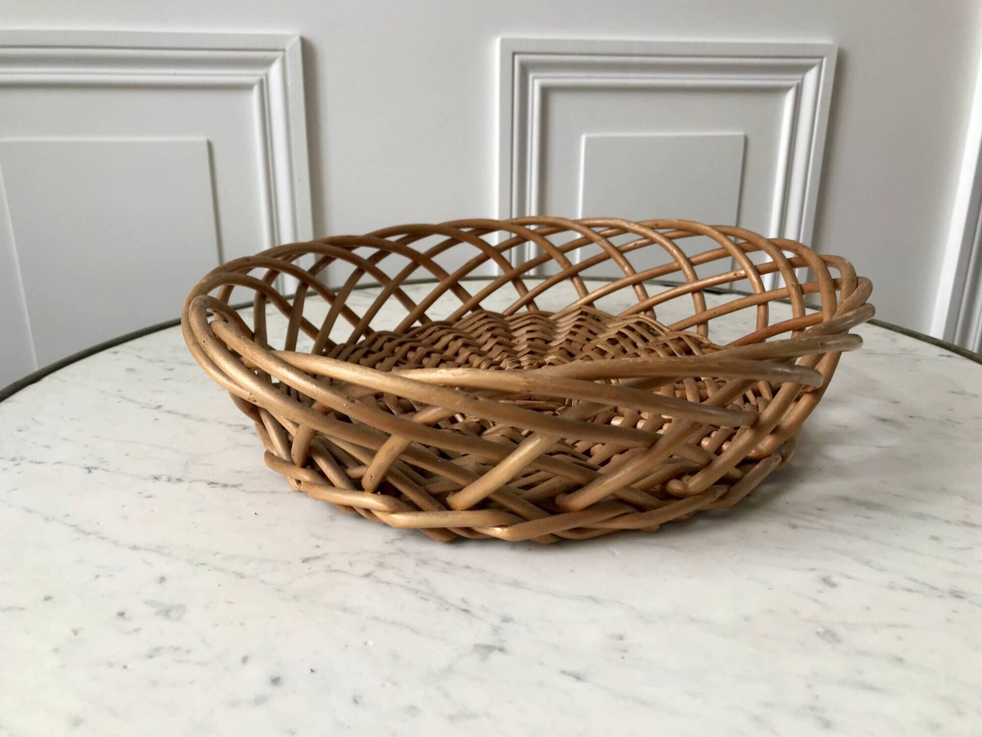 trio of woven rattan and bamboo baskets from the 60s and 70s
