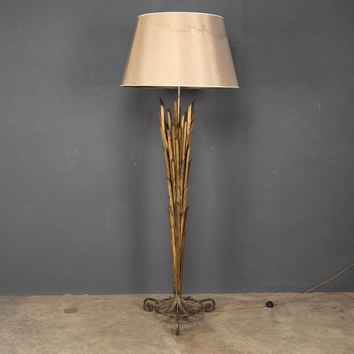 A french gilt wrought iron floor lamp, attributed to maison bagues c.1970