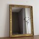Golden mirror from the late 19th century with decoration. 100x80.
