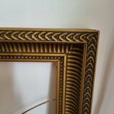 Frame with channels in wood and gilded stucco