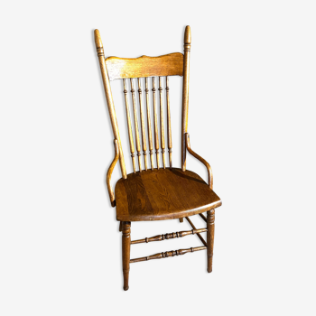 Wooden armchair with high back