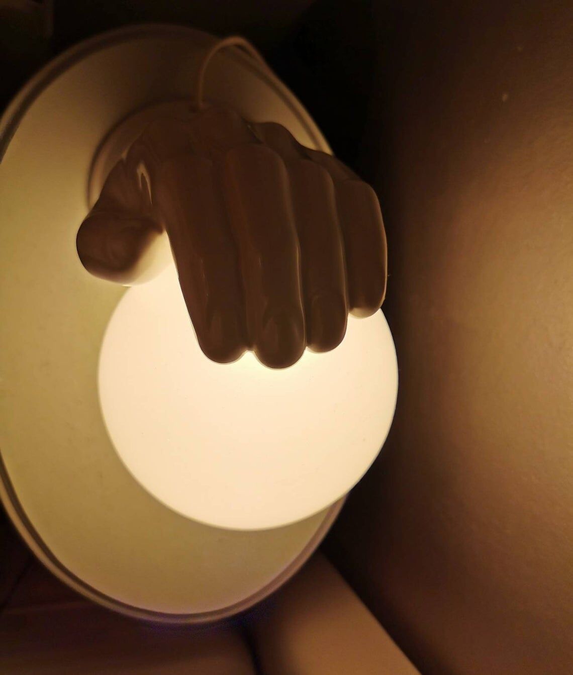 Hand-shaped ceramic wall lamp with 80s glass sphere
