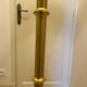 Bronze floor lamp by Lucien Gau, with a six-light shade model 16136.