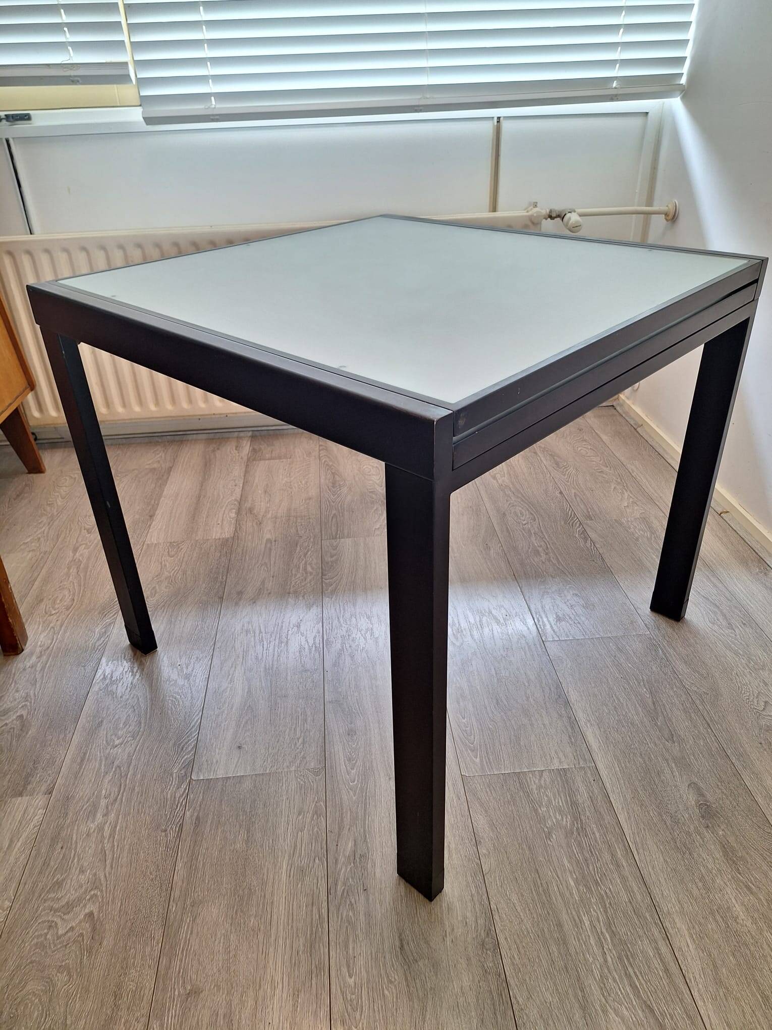 Italian metal table with frosted glass top, extendable.