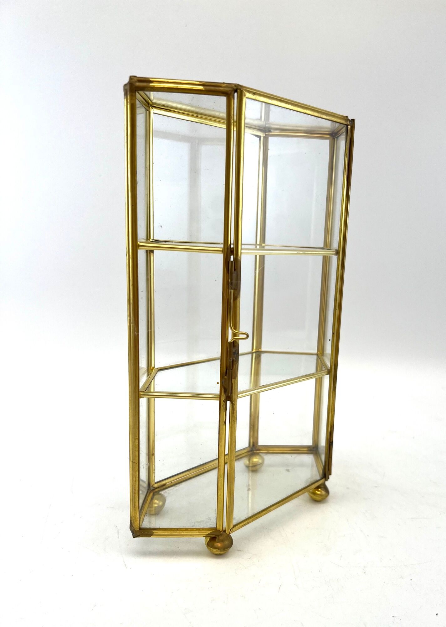 Glass and brass jewelry showcase