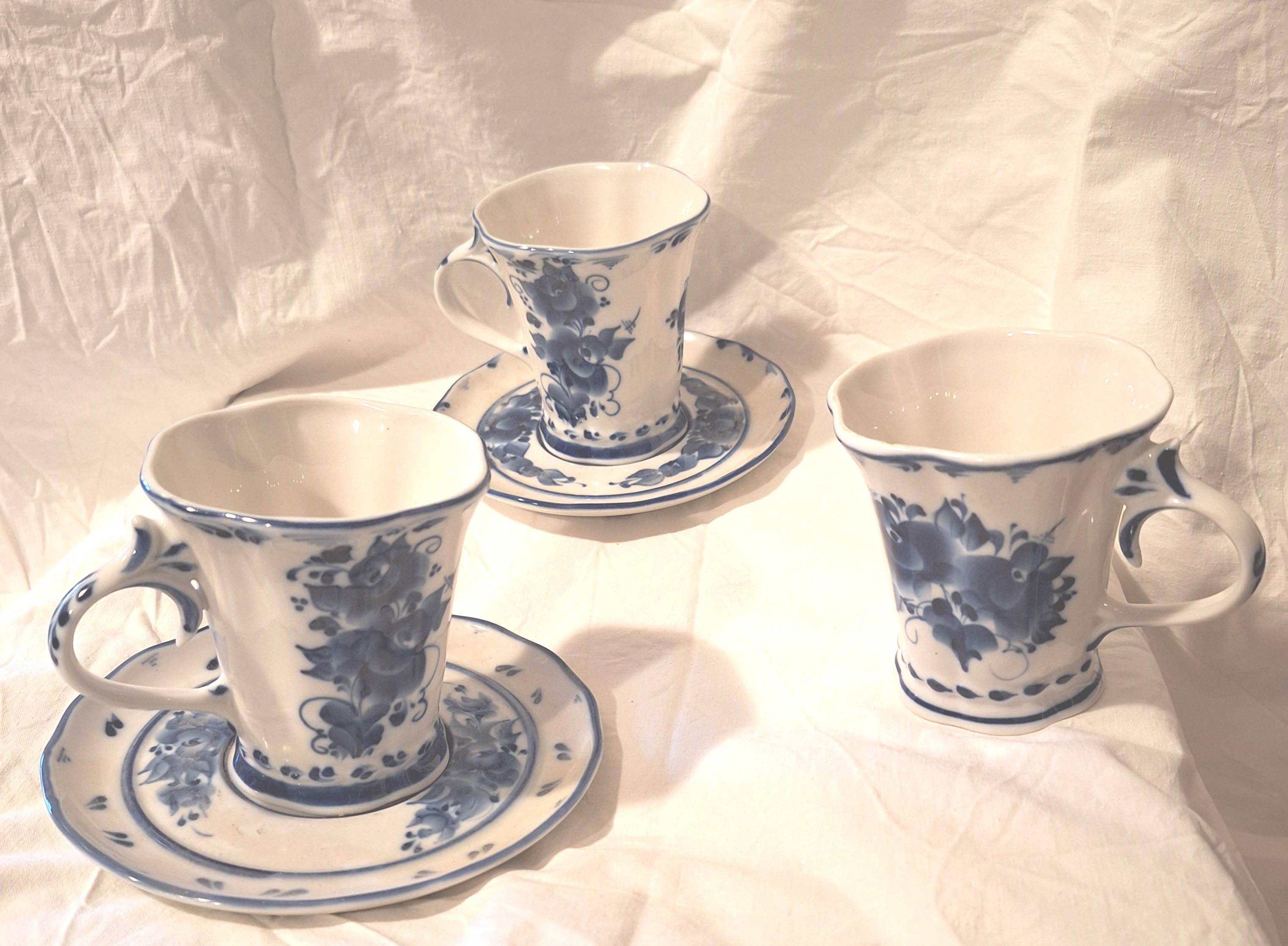 Three cups and two saucers made of Gzhel porcelain.