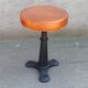 Height-adjustable leather stool with cast iron base