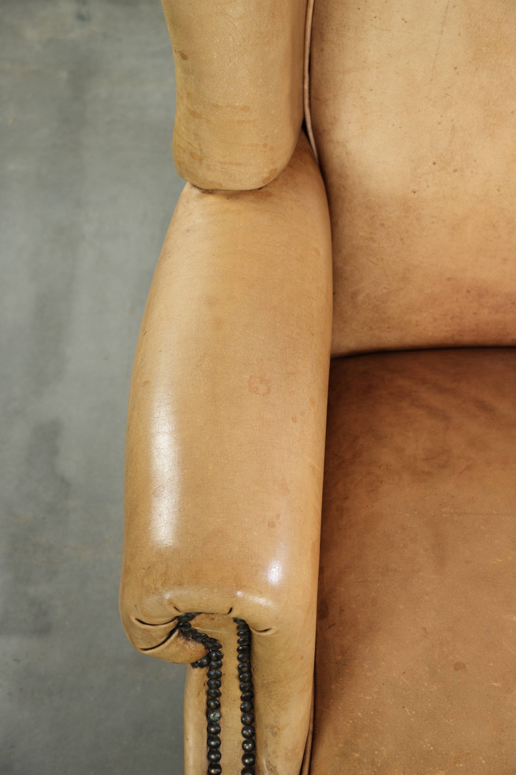 Cow leather wingback armchair with a beautiful timeless English look
