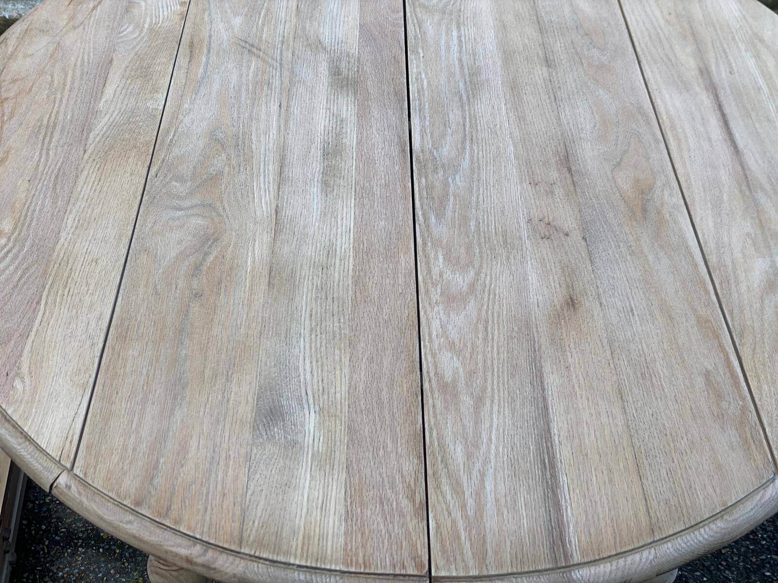 Renovated Louis Philippe round extendable dining table with 4 leaves.
