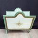 Vintage magazine rack in painted sheet metal