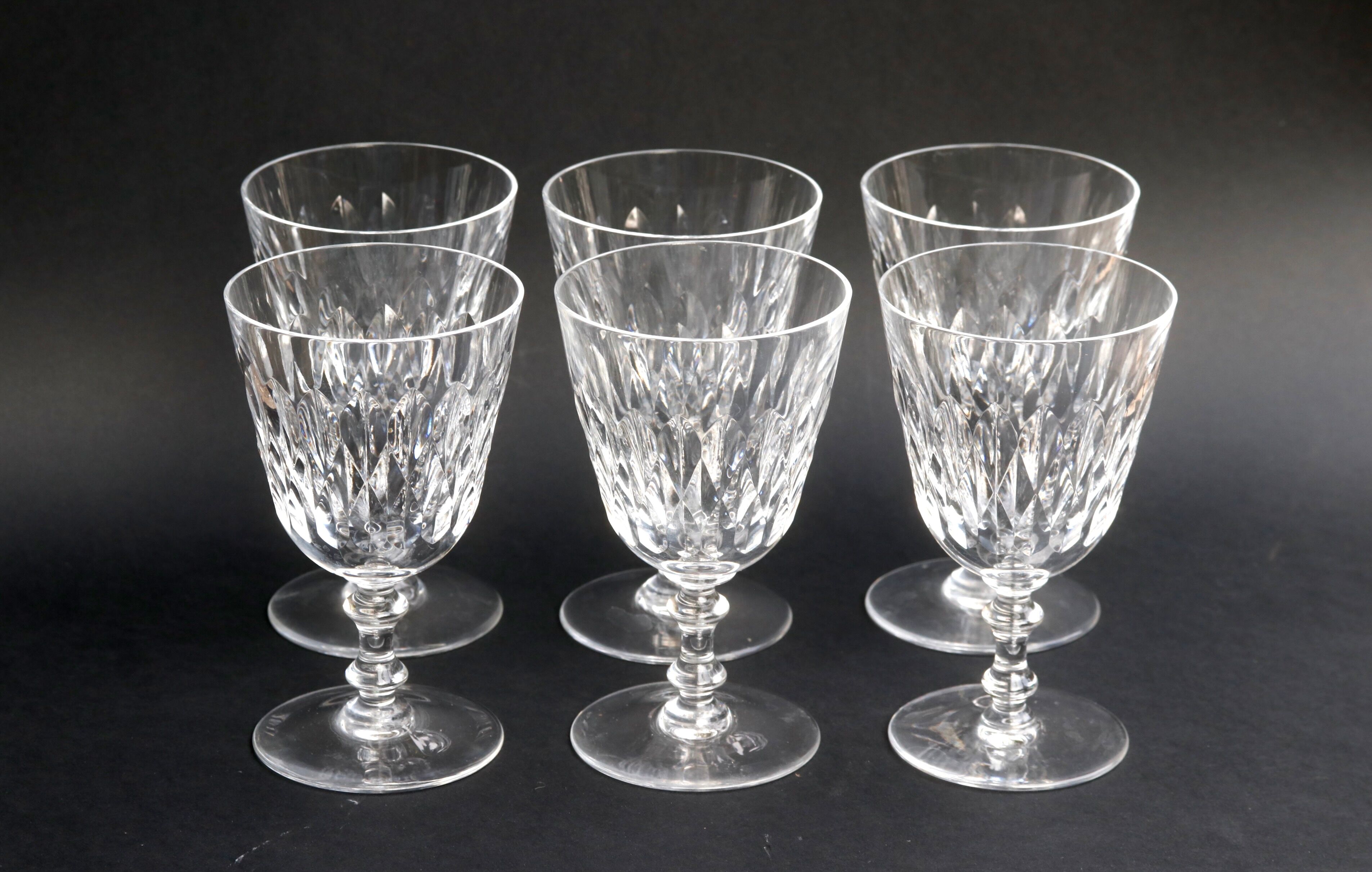 Suite of 6 Baccarat crystal water glasses with honeycomb patterns.