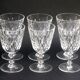 Suite of 6 Baccarat crystal water glasses with honeycomb patterns.