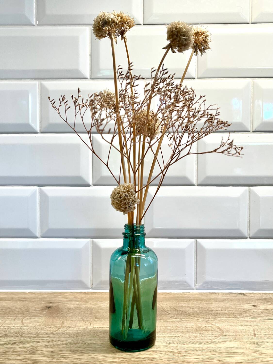 Small vintage dark turquoise blue bottle