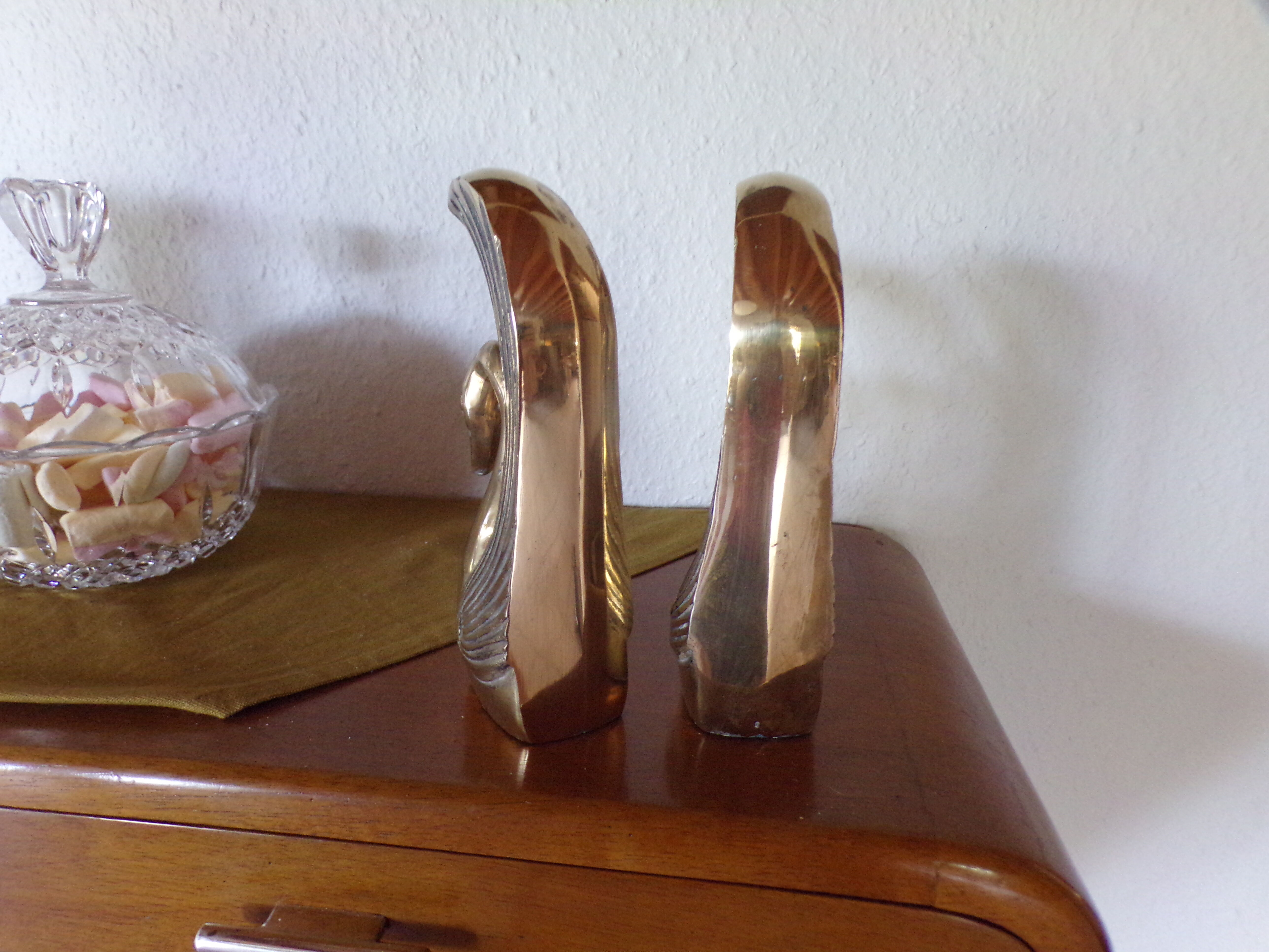 Pair of greenhouse books brass swans