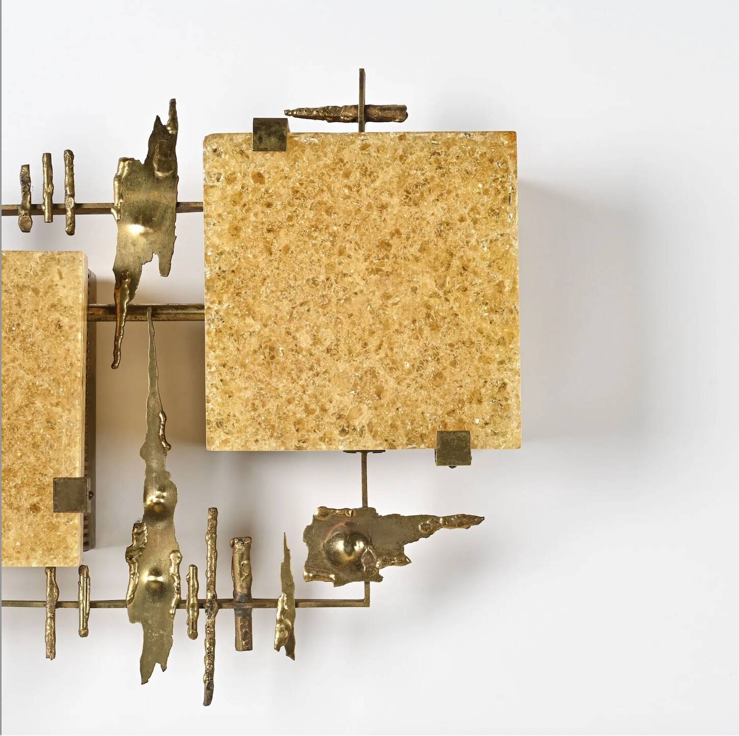 Pair of brutalist wall sconces in brass and fractal resin from the 1970s.