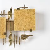 Pair of brutalist wall sconces in brass and fractal resin from the 1970s.