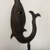 Old and patinated metal candlestick