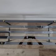 Vintage coffee table in glass and mirror strips.